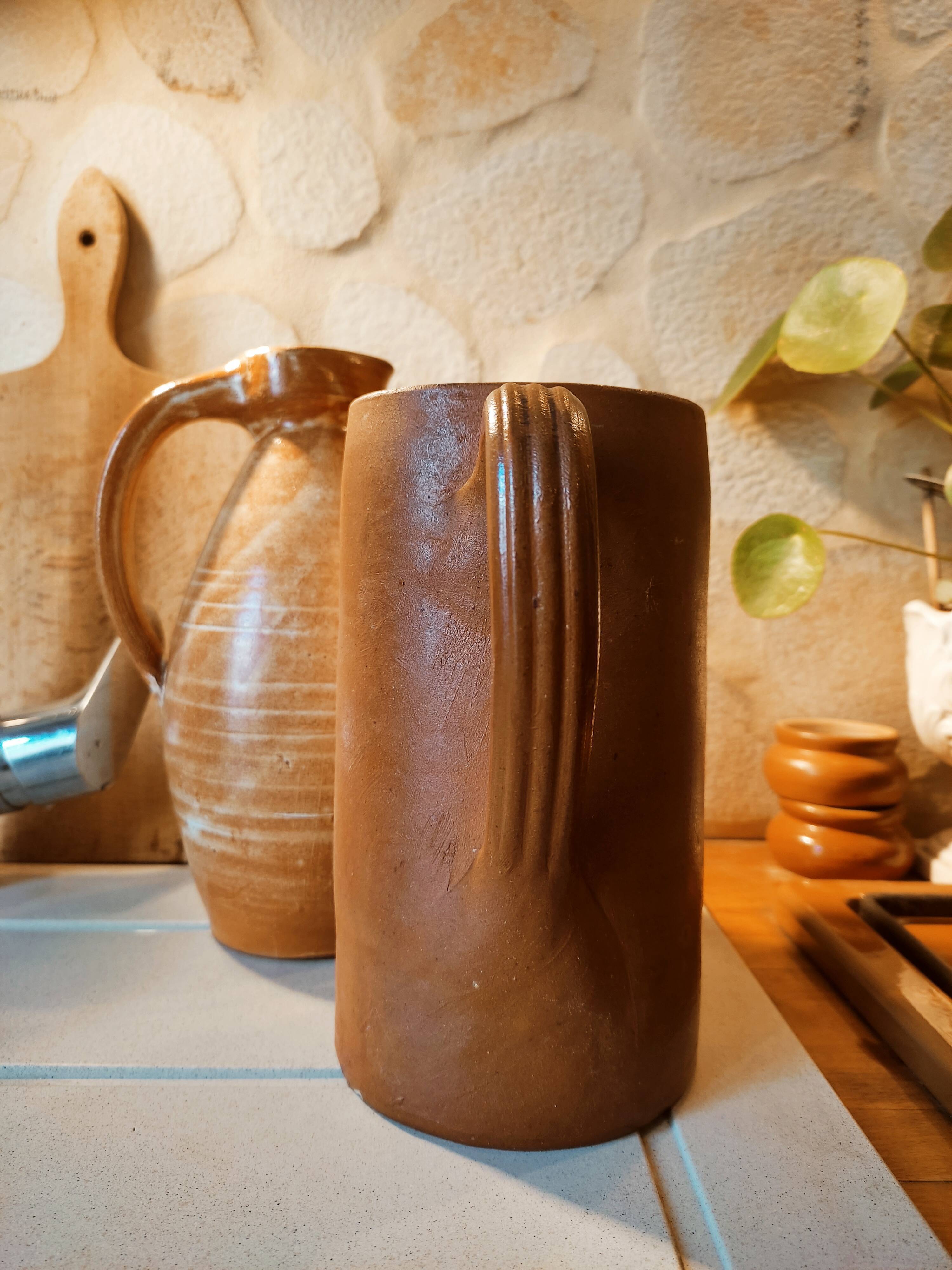 Duo of pitchers water, wine