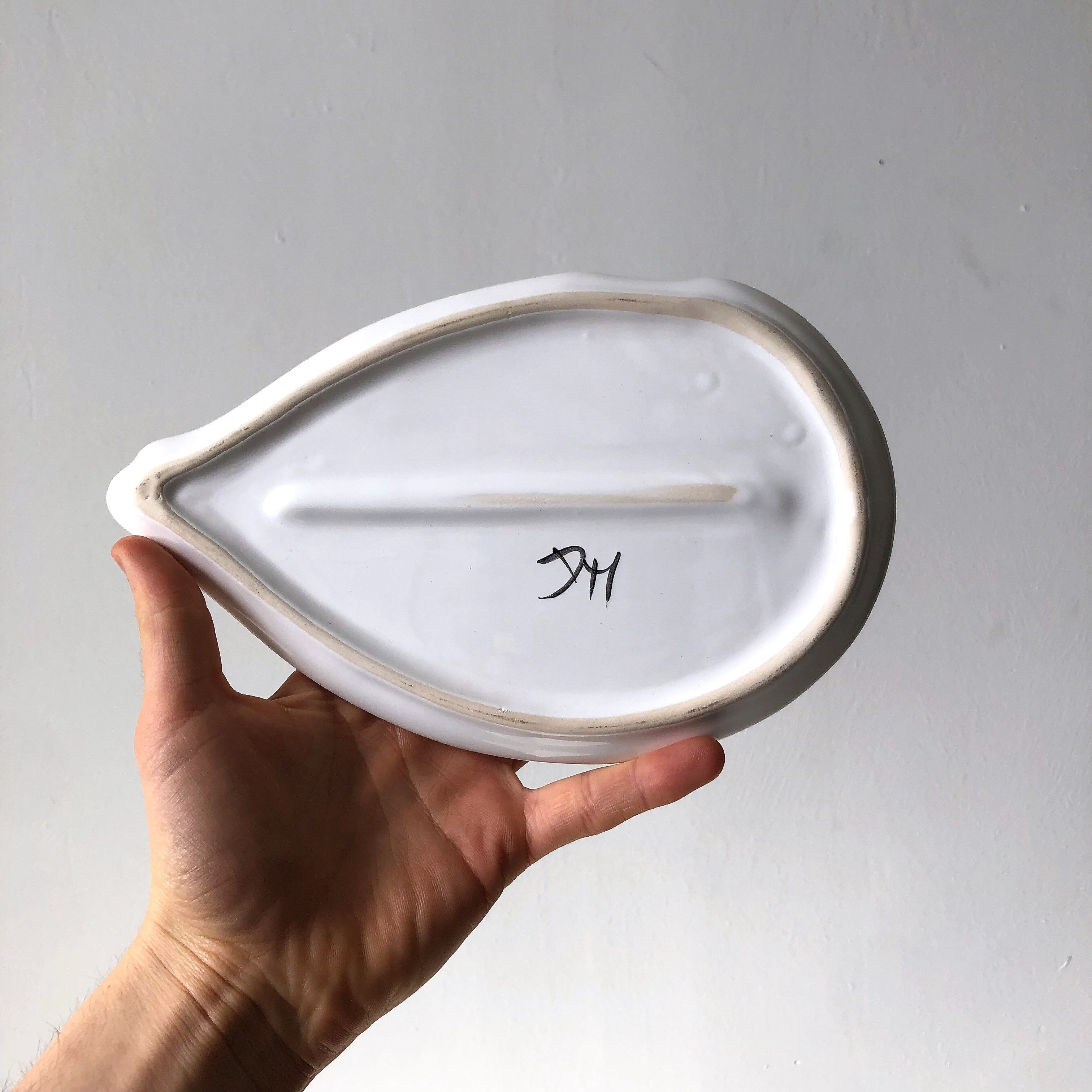 Elegant serving dish in vintage white goose ceramic. Signed DH