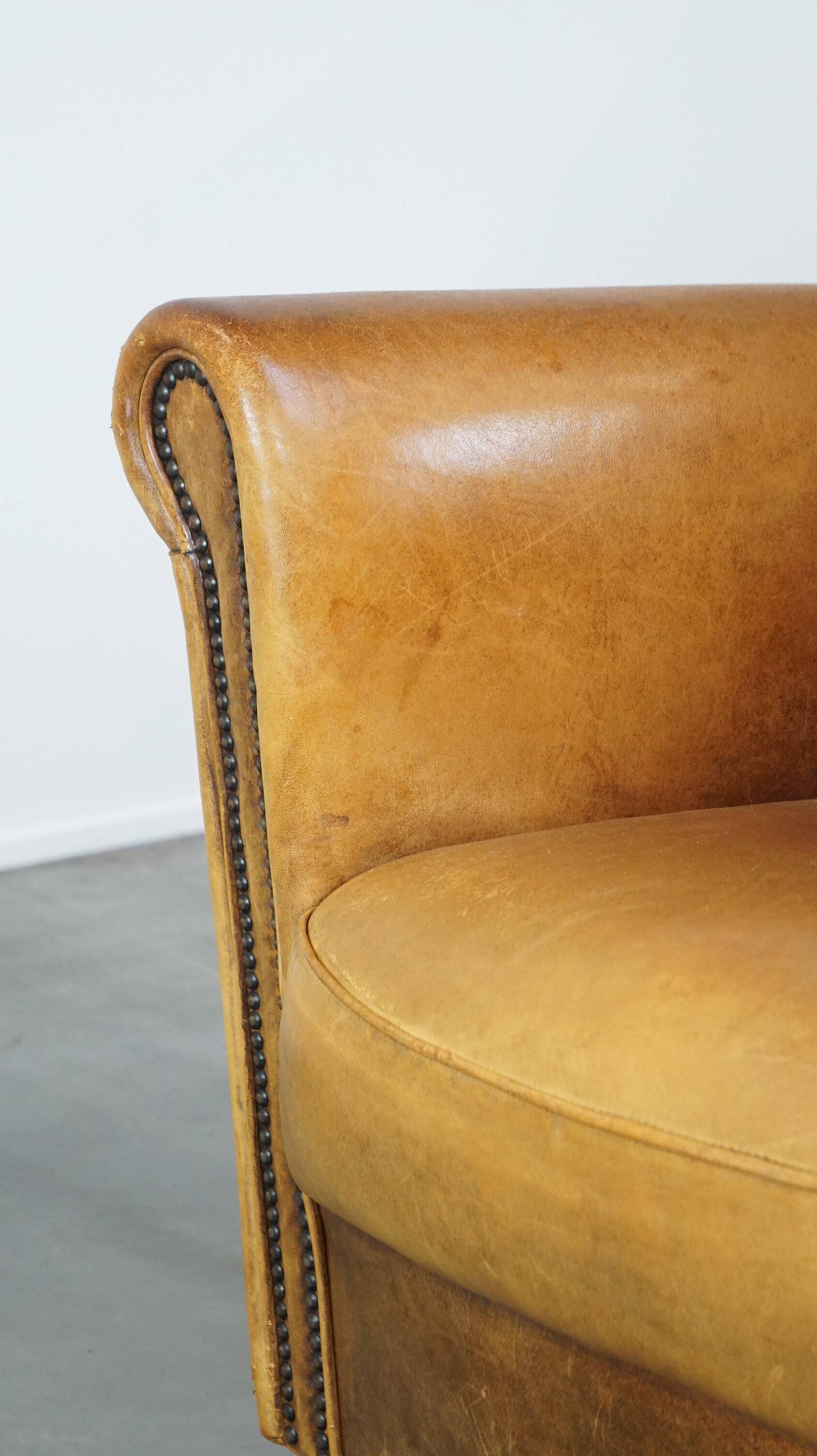 Stately, sleekly finished, comfortable sheepskin armchair