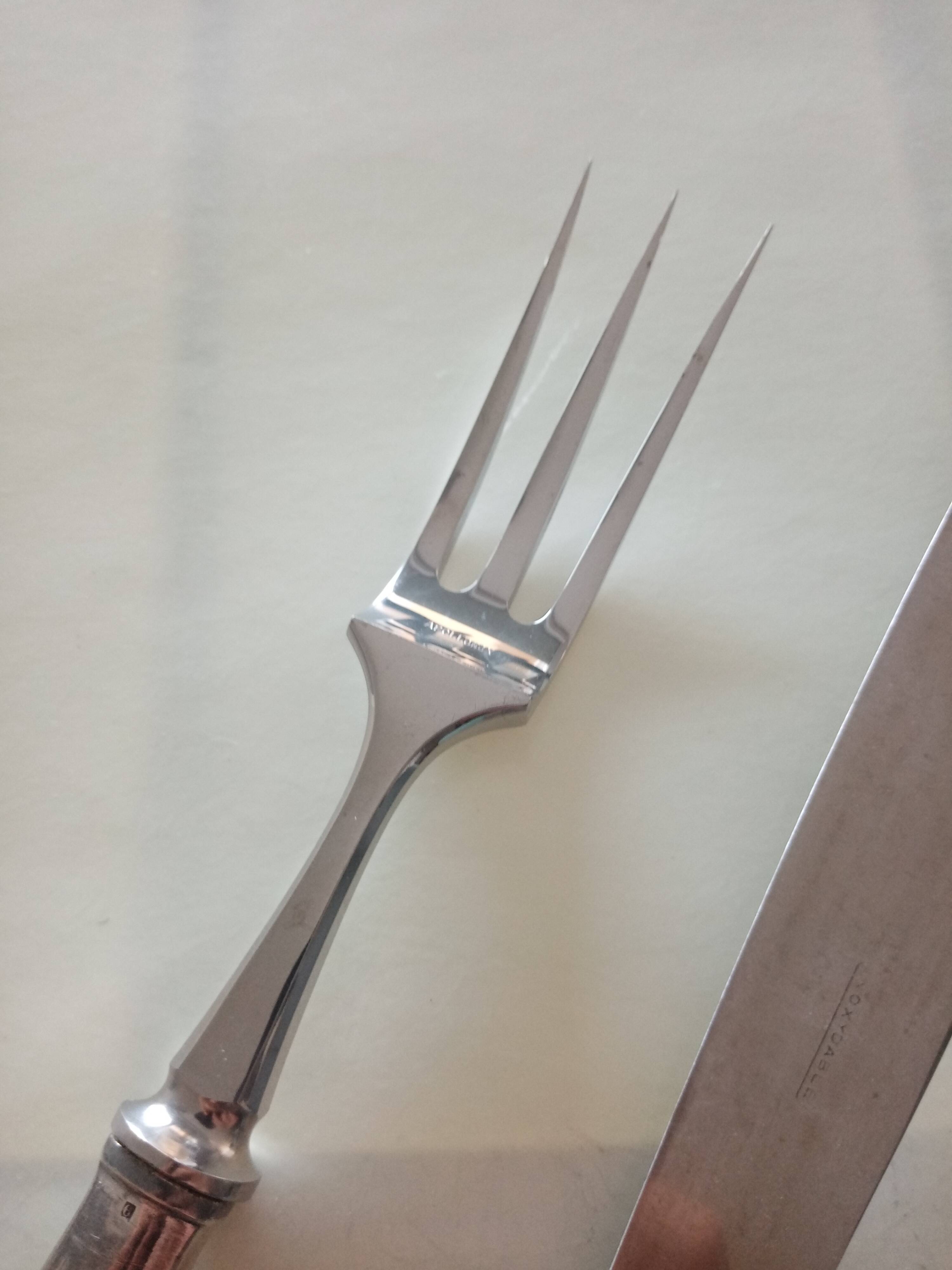 Serving cutlery in silver metal