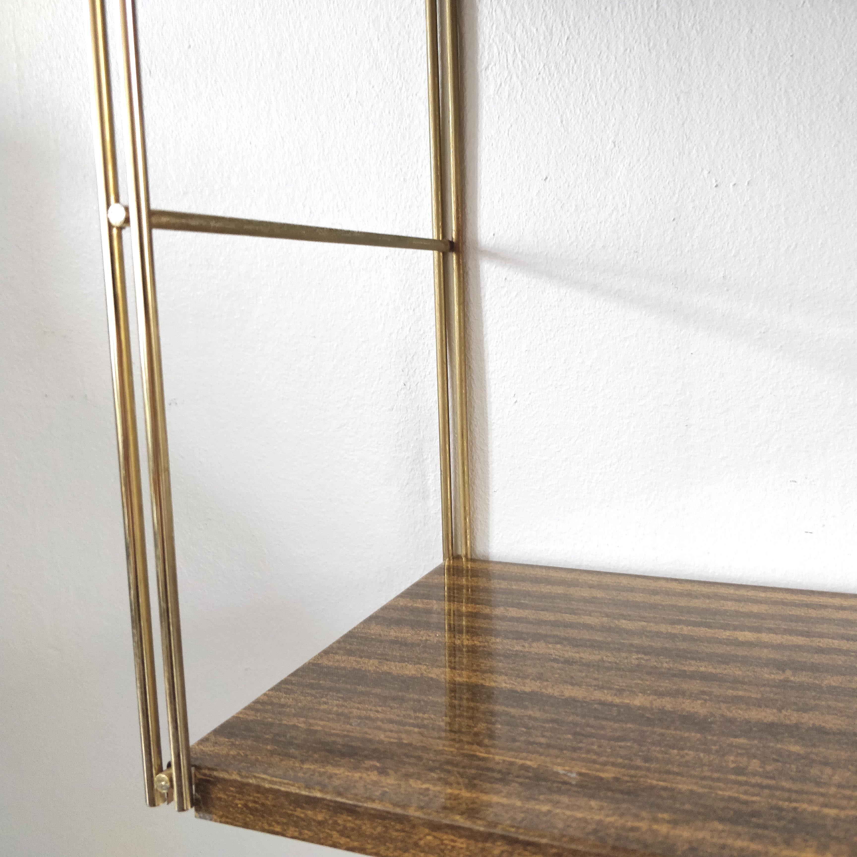Brown metal string shelf and gilded studs 1960