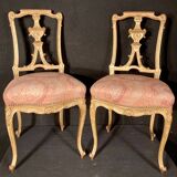 Pair of gilded wooden chairs