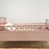 Vintage old pink wooden baby bed