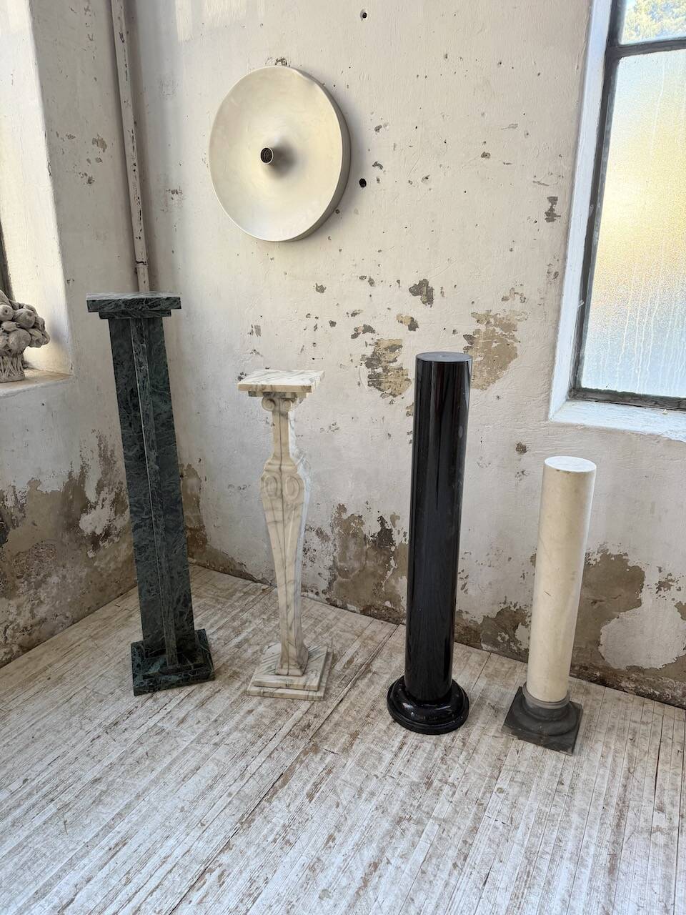 Set of 4 marble columns or pedestals.