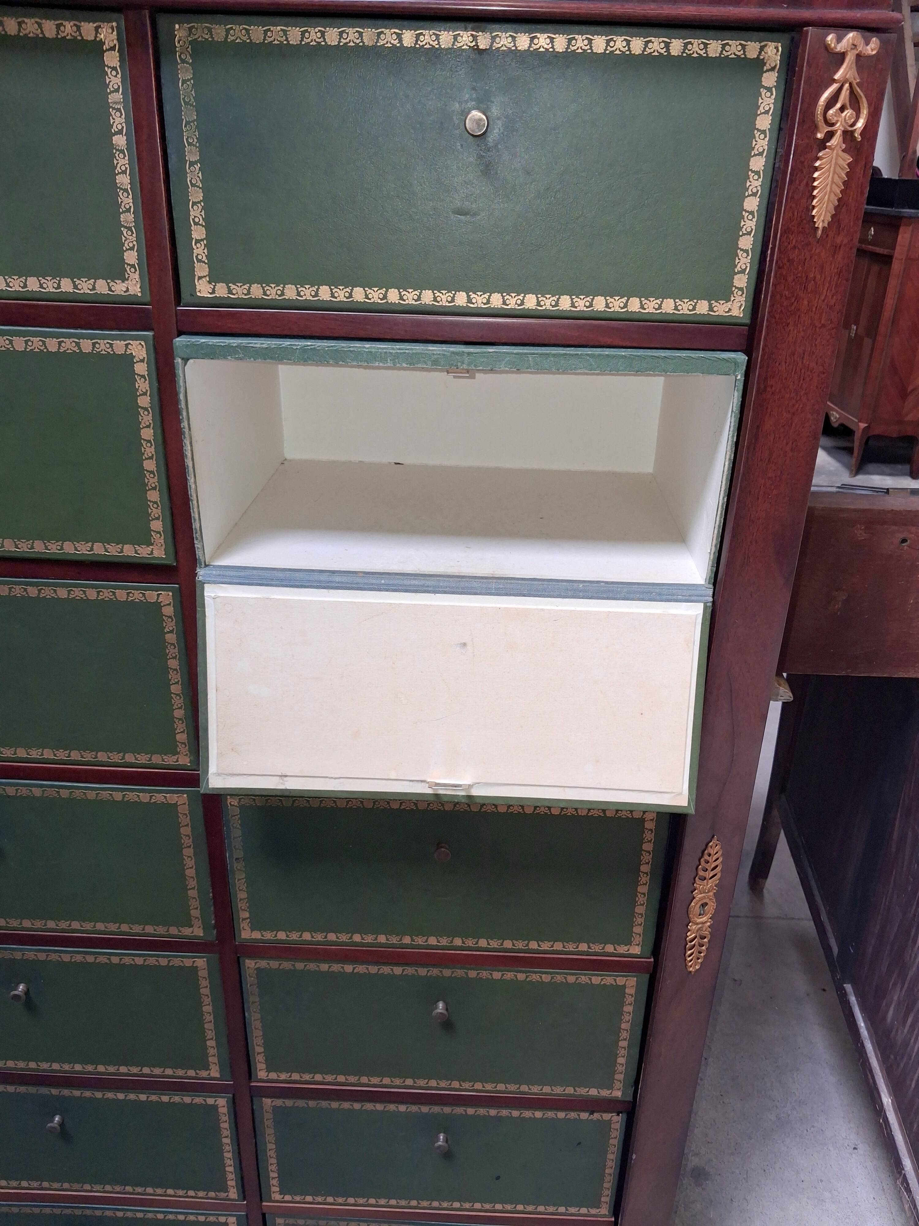 Empire-style mahogany cabinet – 12 drawers lined with green leather –