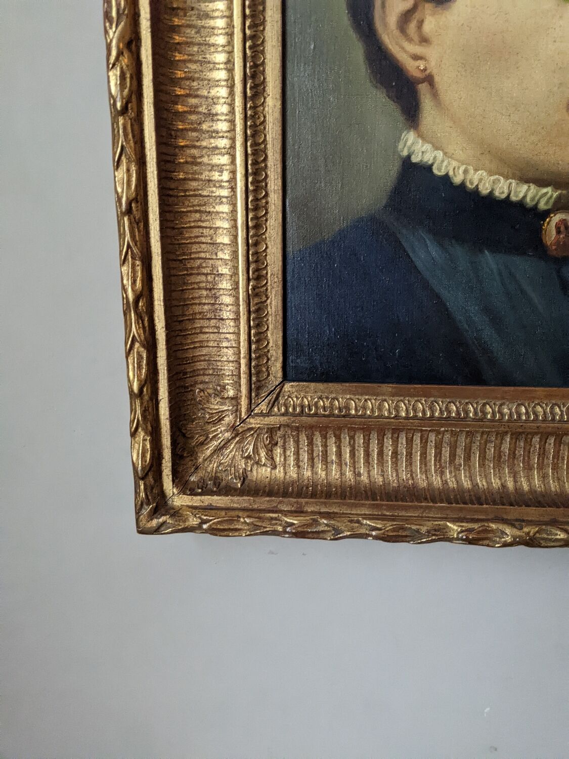 Oil on canvas portrait in an antique gilded wooden frame.