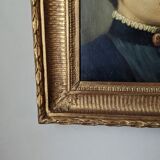 Oil on canvas portrait in an antique gilded wooden frame.
