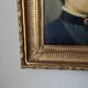 Oil on canvas portrait in an antique gilded wooden frame.