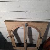Old arched window made of fir wood