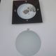 Wall light or ceiling light in frosted glass and leather-like material.