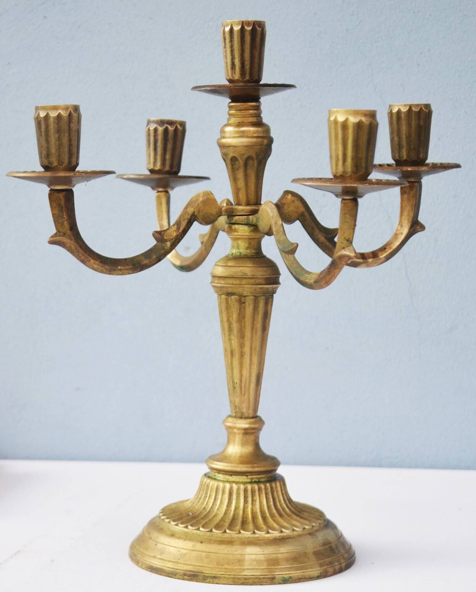 Solid brass candle holder with 5 candles and 4 arms
