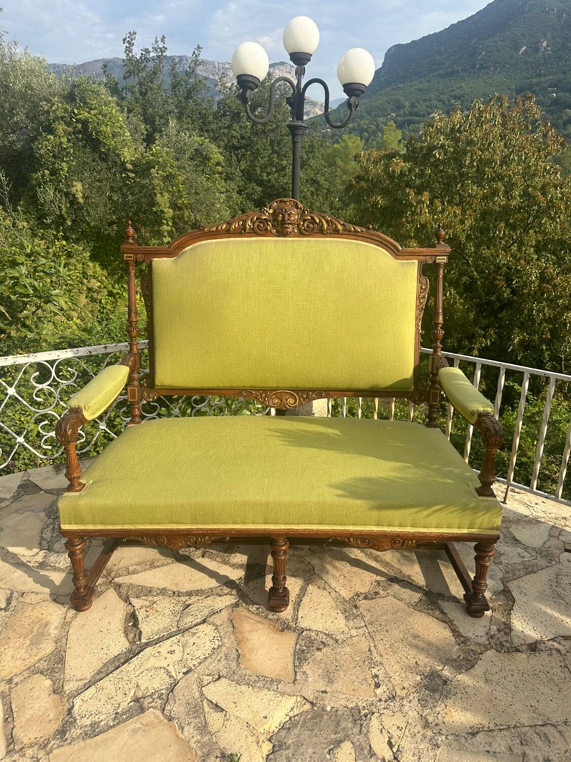 Richly carved solid wood bench in Louis XVI style.