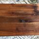 Antique Louis Philippe style farm table in solid cherry wood with turned base.