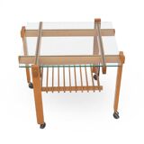 Wood and glass coffee table with wheels, 1960s.