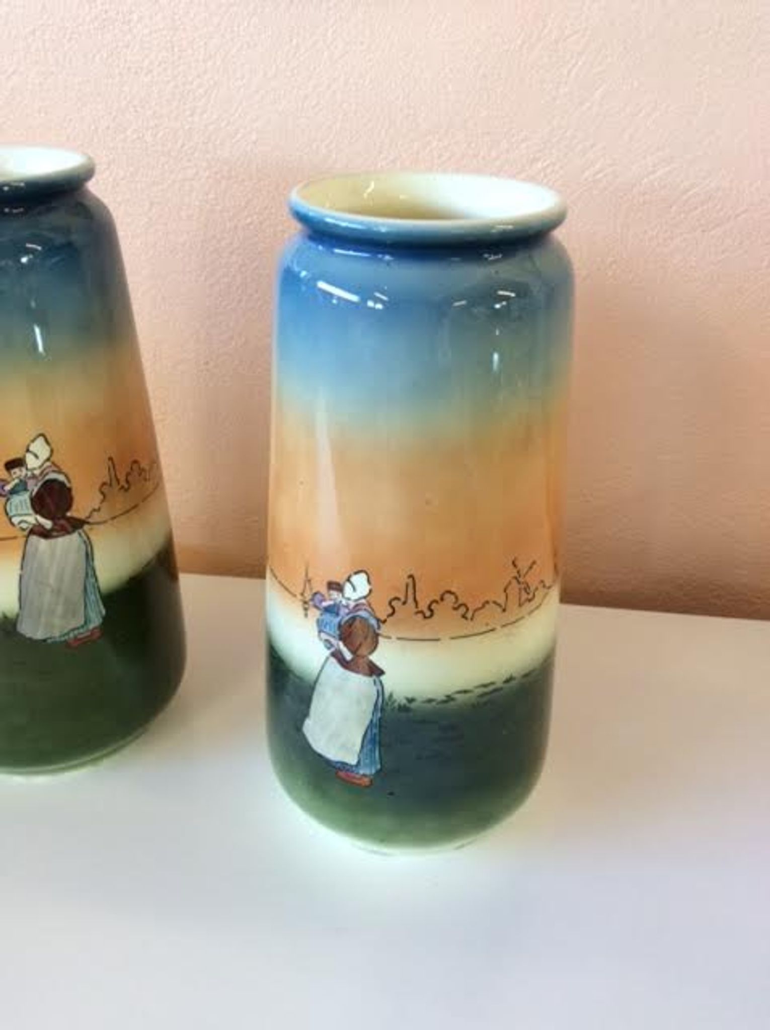 Pair of enamelled sandstone vases