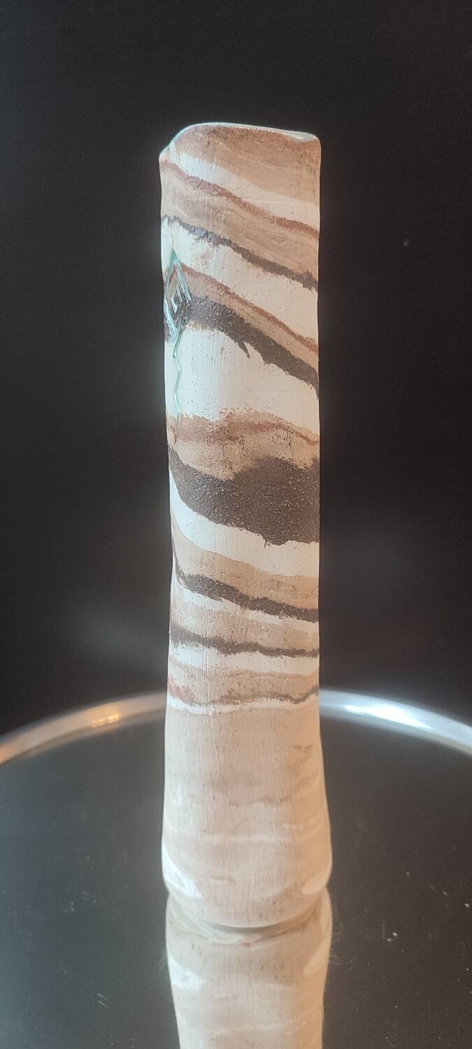 Turned stoneware vase signed with relief decoration.