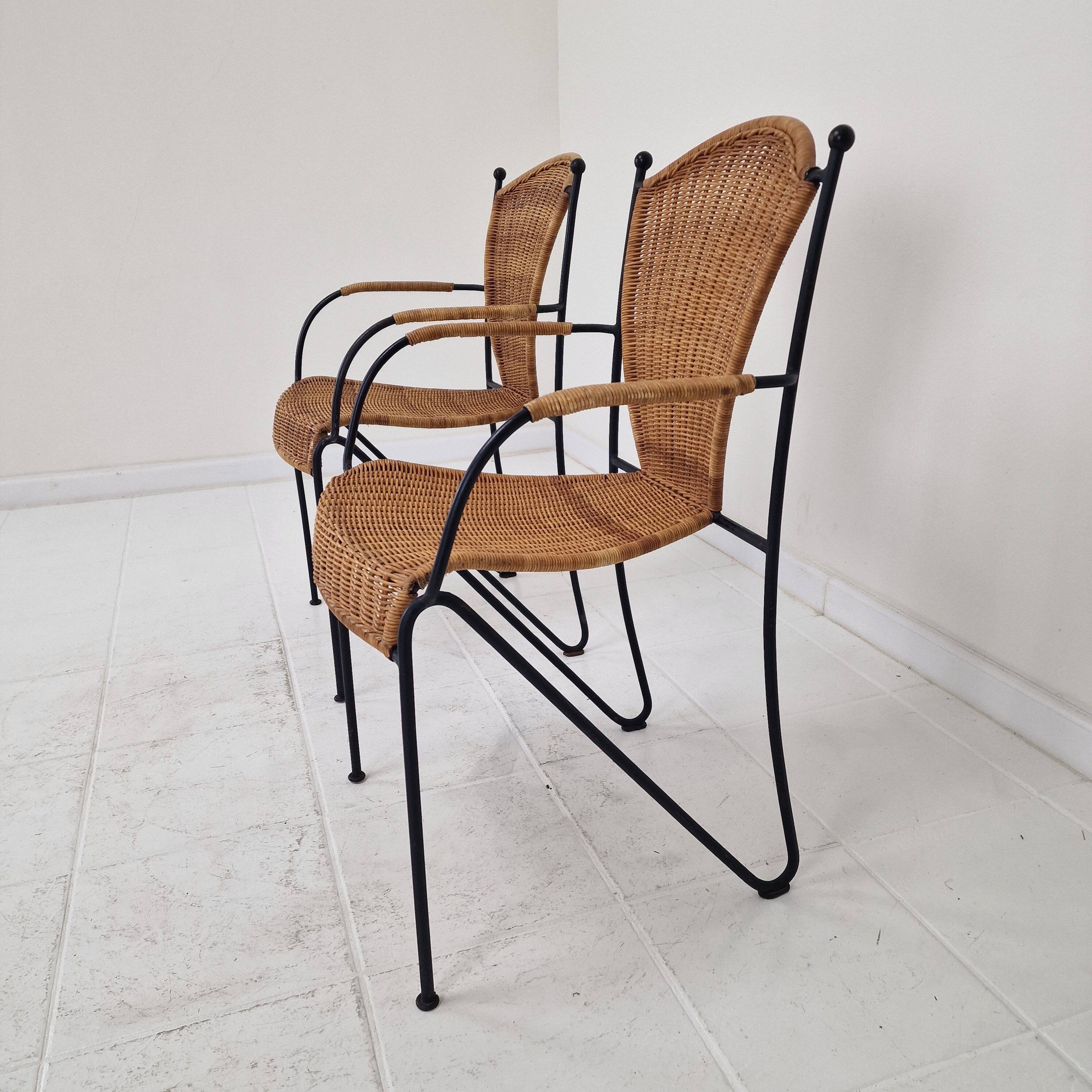Pair of wicker and iron armchairs by Frederic Weinberg, United States, 1950s.