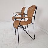 Pair of wicker and iron armchairs by Frederic Weinberg, United States, 1950s.