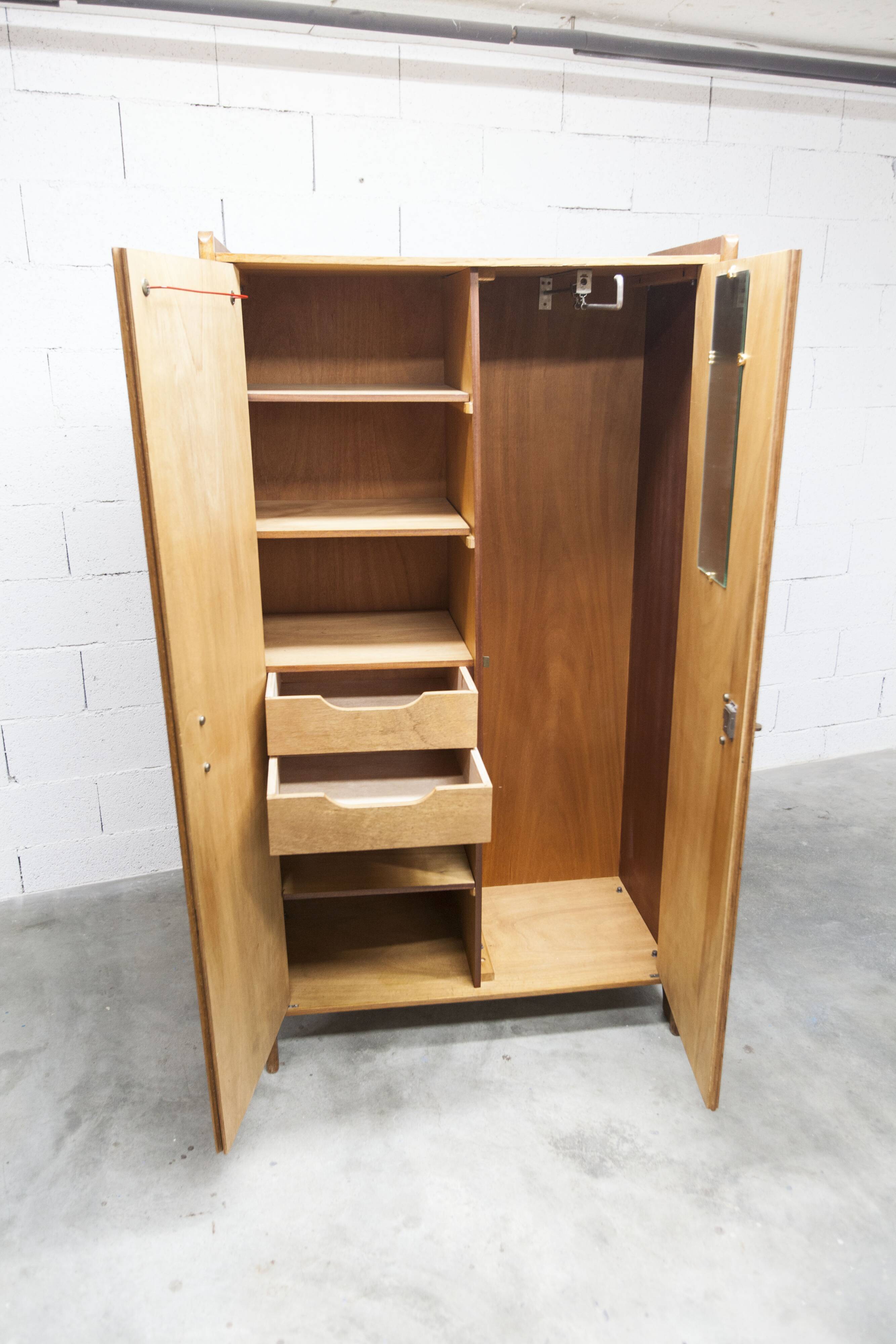1950s Mid-Century Modern oak armoire with two doors and two drawers.