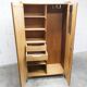 1950s Mid-Century Modern oak armoire with two doors and two drawers.