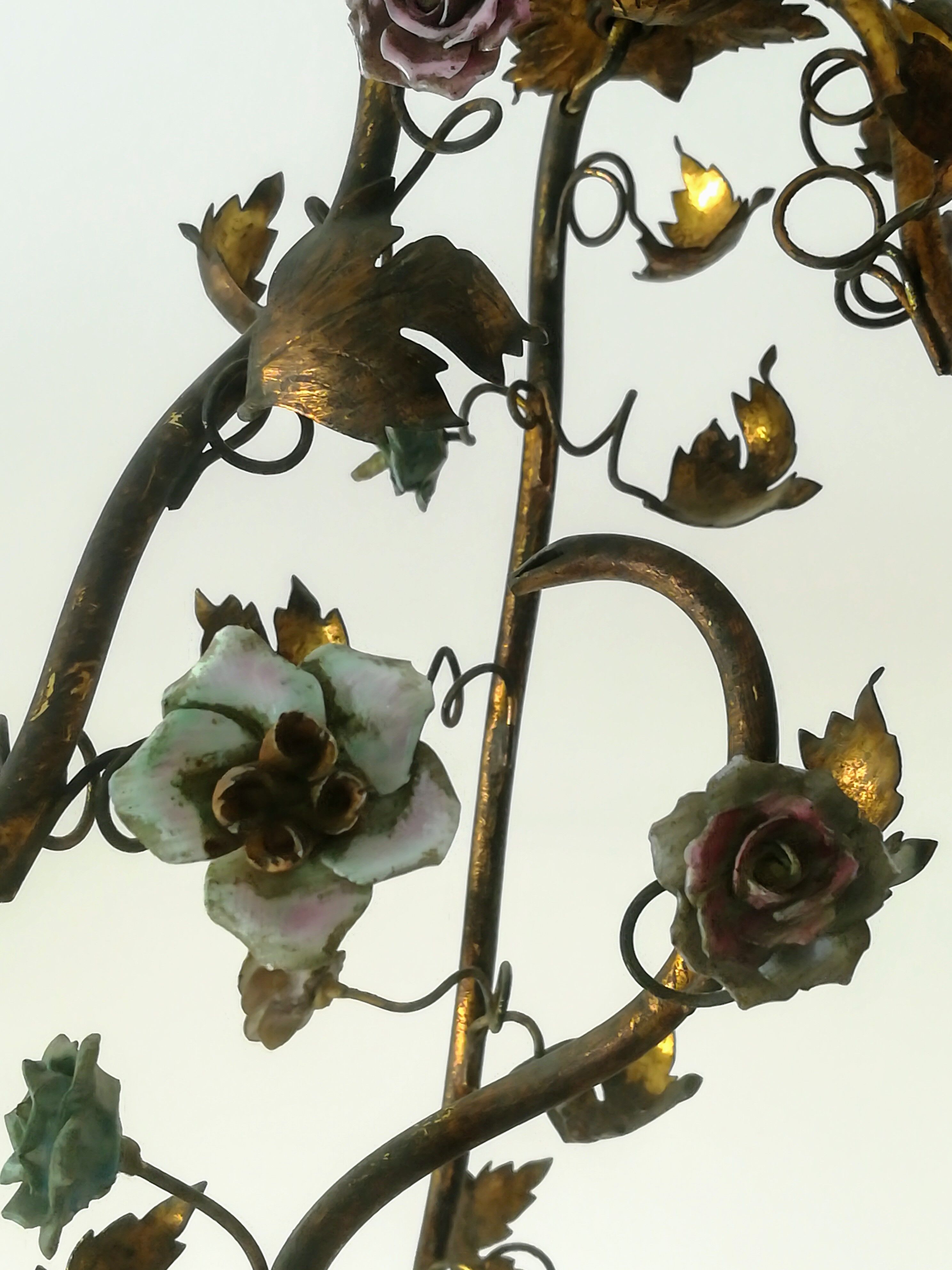 Brass chandelier and porcelain flowers