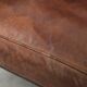 Subtle dark brown sheepskin wingback armchair with a timeless look subtle