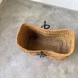 Magazine rack or log rack in straw with brutalist base from the 50s