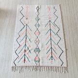 White wool Berber rug with fluorescent orange green patterns