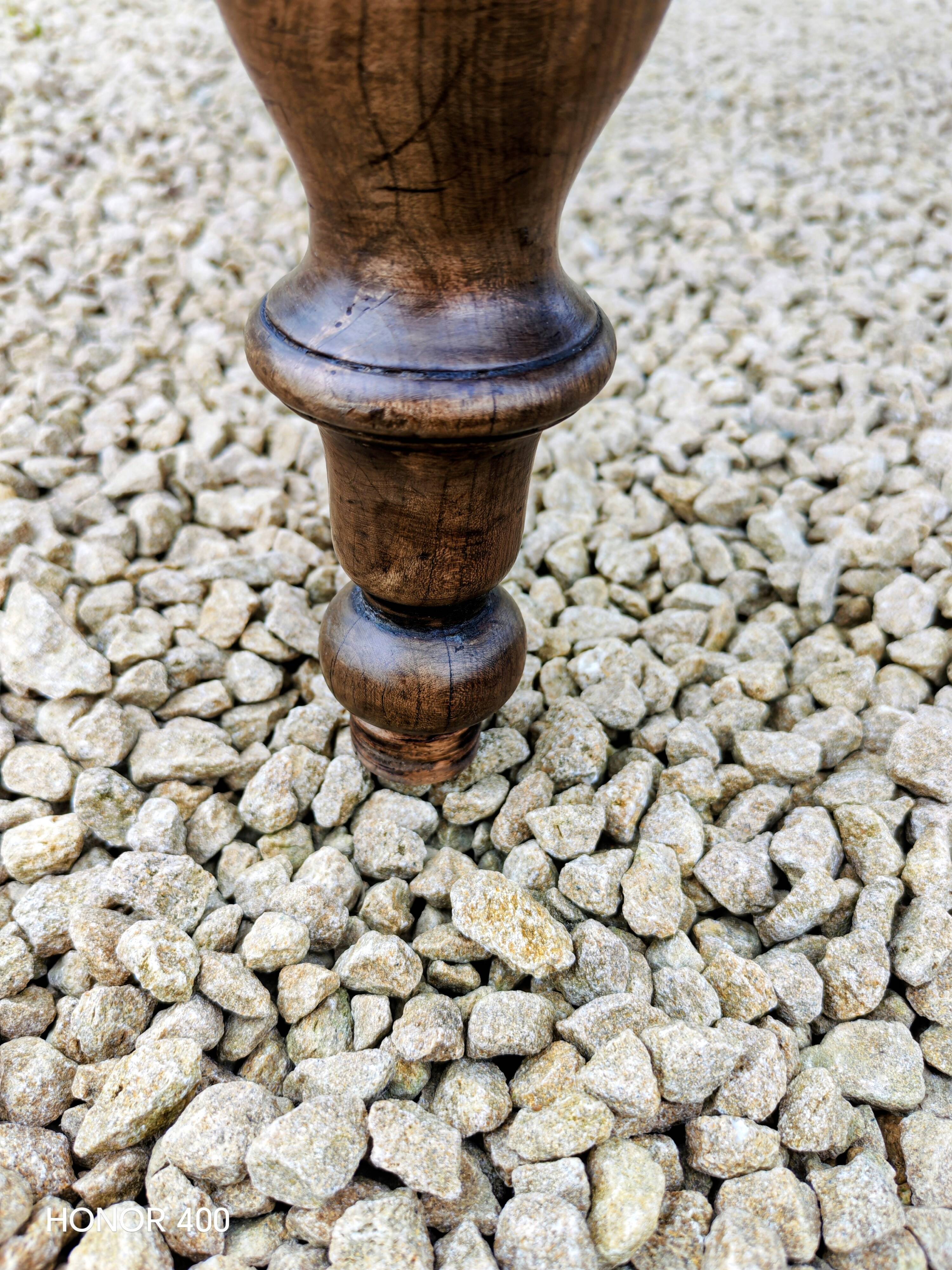 Old French farmhouse table in walnut with turned legs.