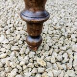 Old French farmhouse table in walnut with turned legs.