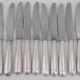 Alfénide Christofle Louvois Shell, 24 knives: 12 dinner knives + 12 cheese knives.