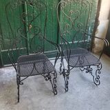 Pair of black wrought iron armchairs