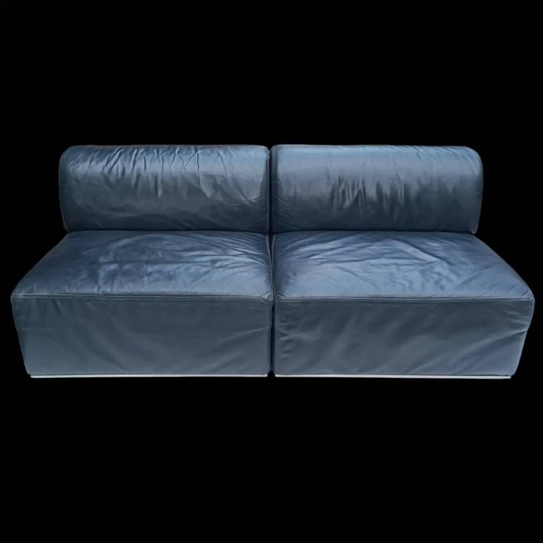 Pair of vintage black leather easy chairs