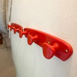 Orange/red plastic hooks year 60