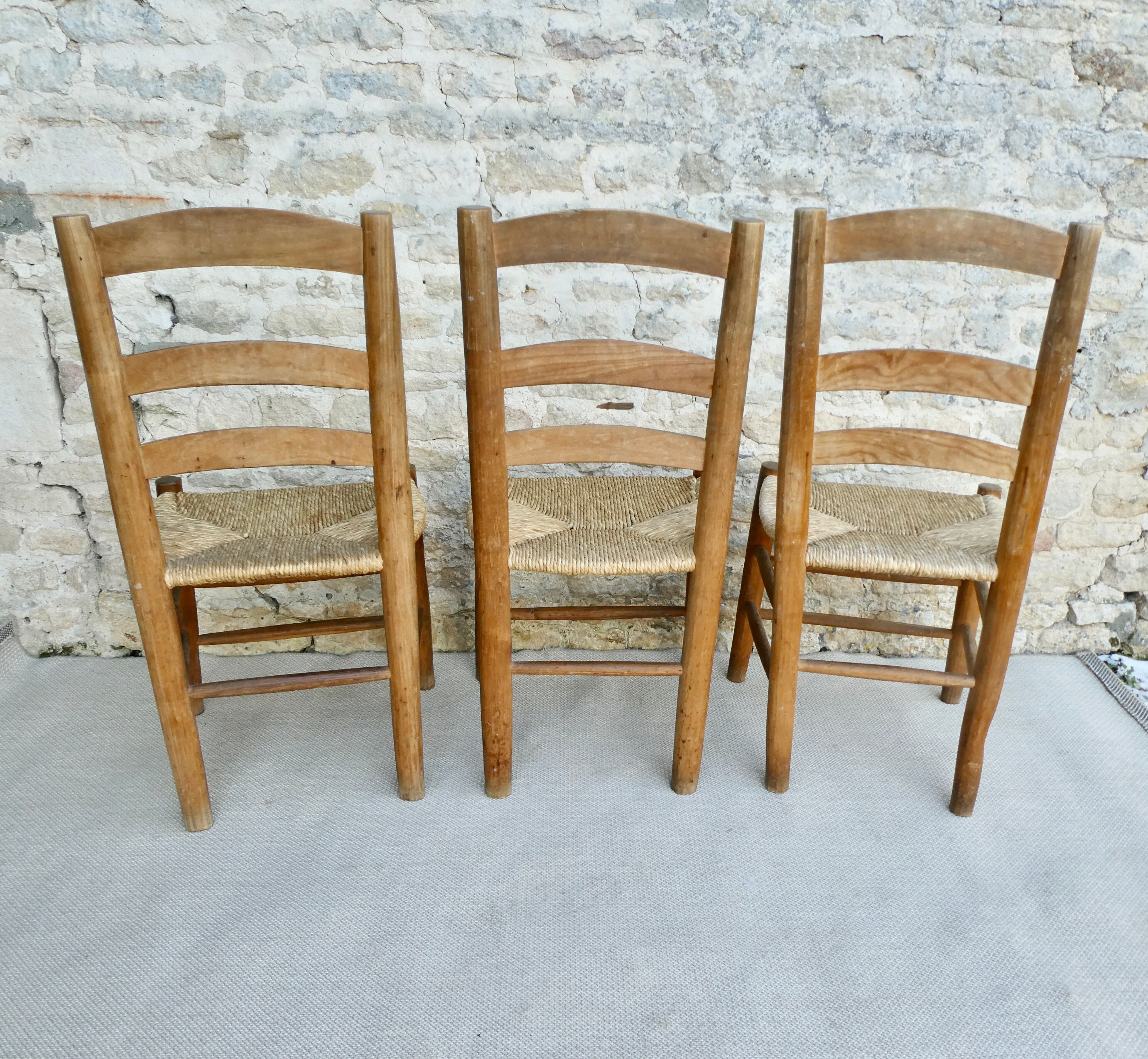 Trio of wooden chairs and mulched seat