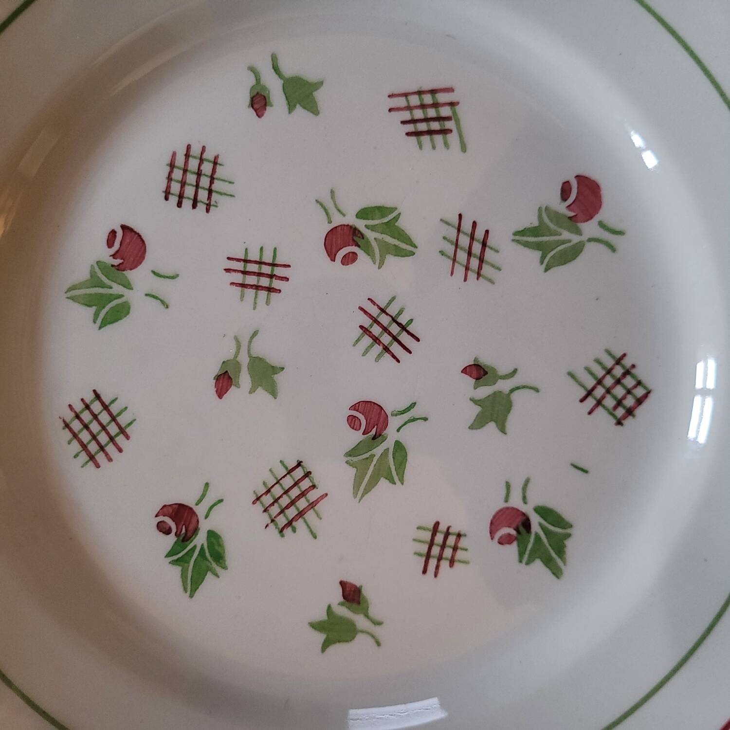 11 dinner plates decorated with stylized roses. 1950s. 11 dinner plates