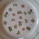 11 dinner plates decorated with stylized roses. 1950s. 11 dinner plates