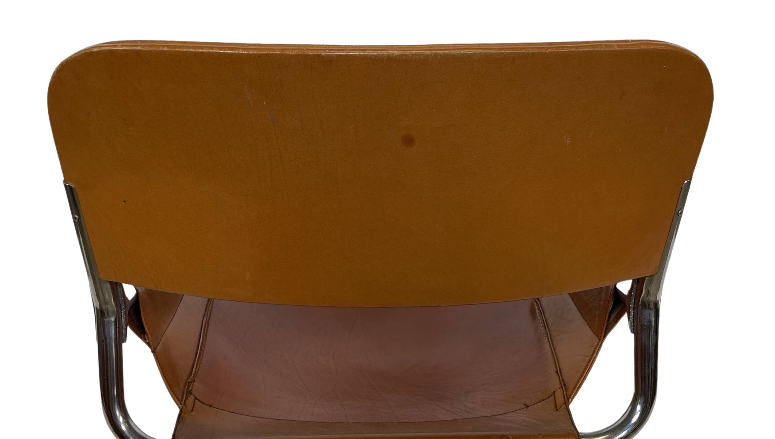 vintage dining room chair in cognac leather and chrome 1970s Italy