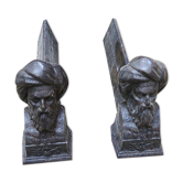 Pair of men's cast iron channels with turban
