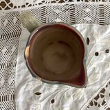 Antique pitcher in thought slip