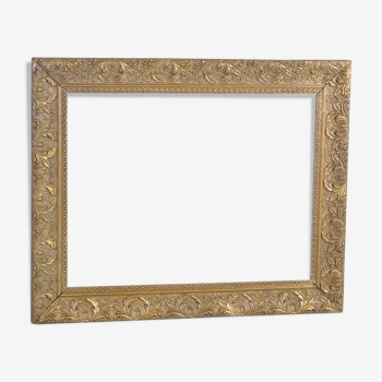 Old wooden frame, gilded stucco