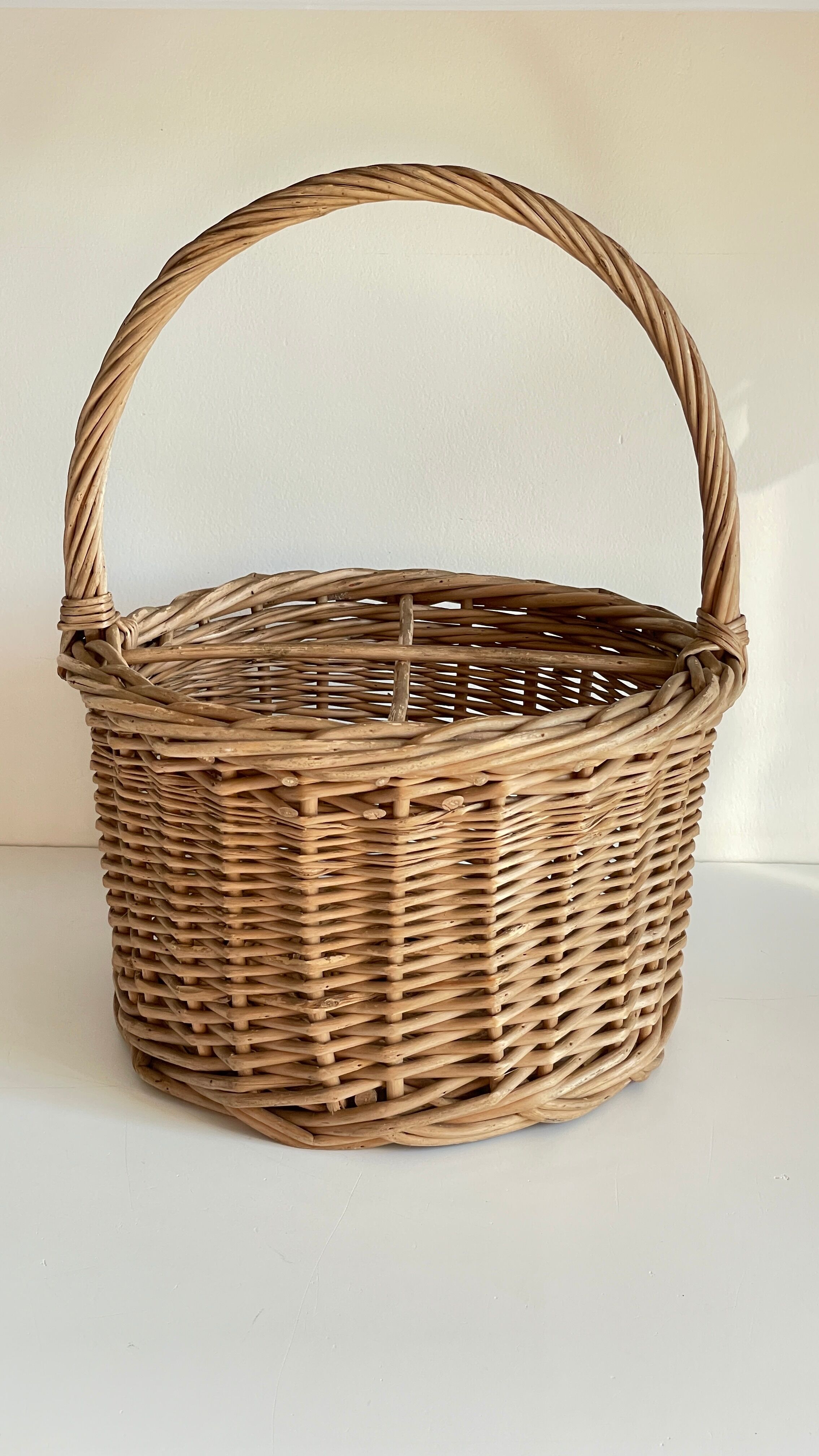 Basket with vintage rattan bottles