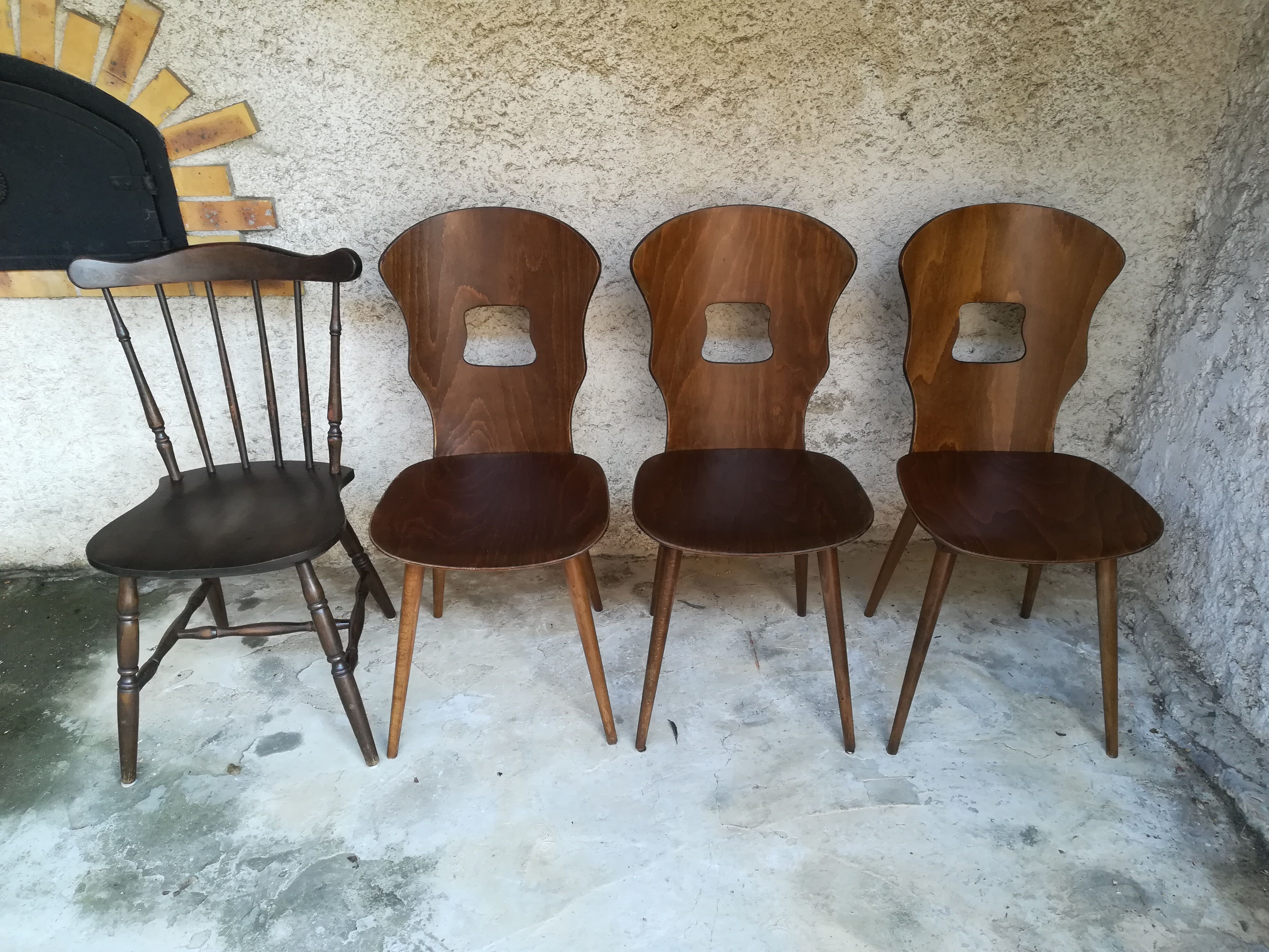 Eight mismatched bistro chairs
