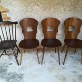 Eight mismatched bistro chairs