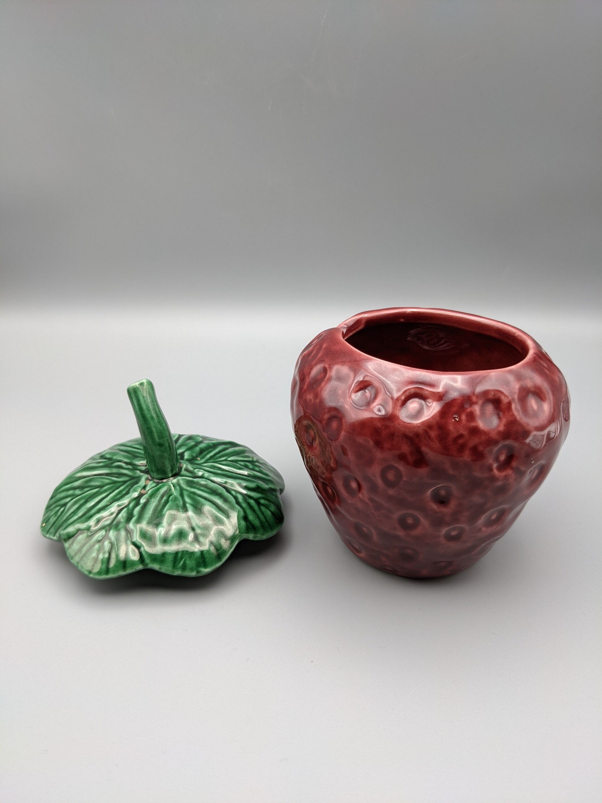 Condiment jar mustard jam in the shape of strawberry