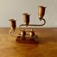 Pair of Art Deco candlesticks in gilded brass and wood