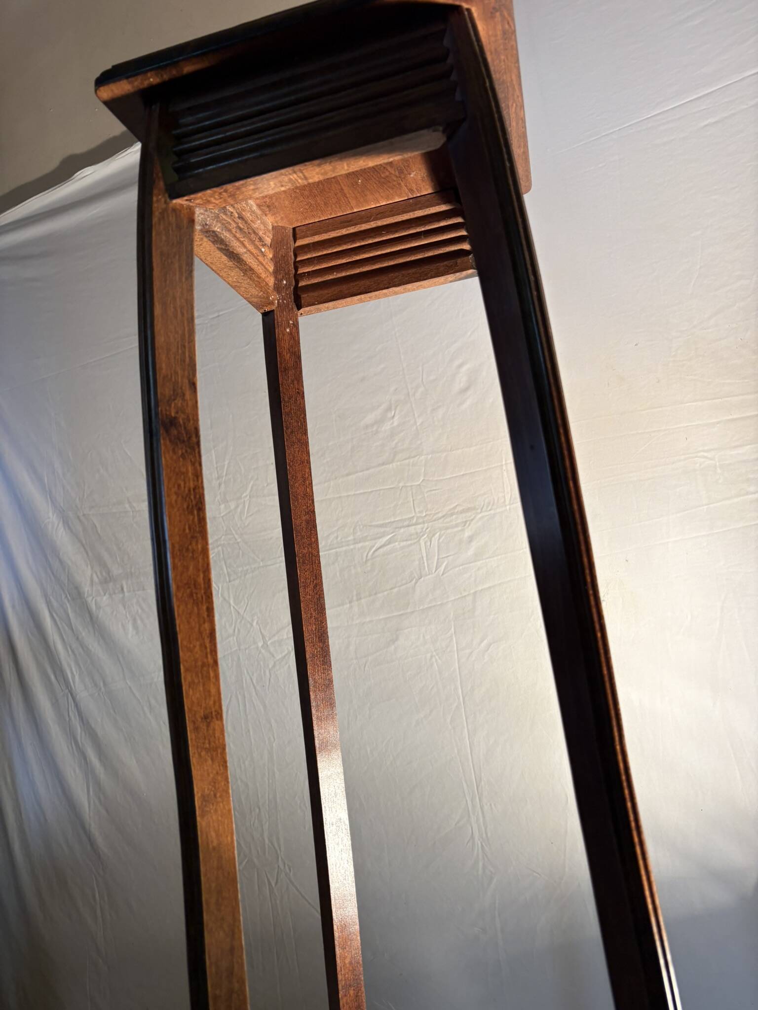 Vintage dark wood side table with curved base