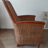 Armchair in woven rattan and exotic wood