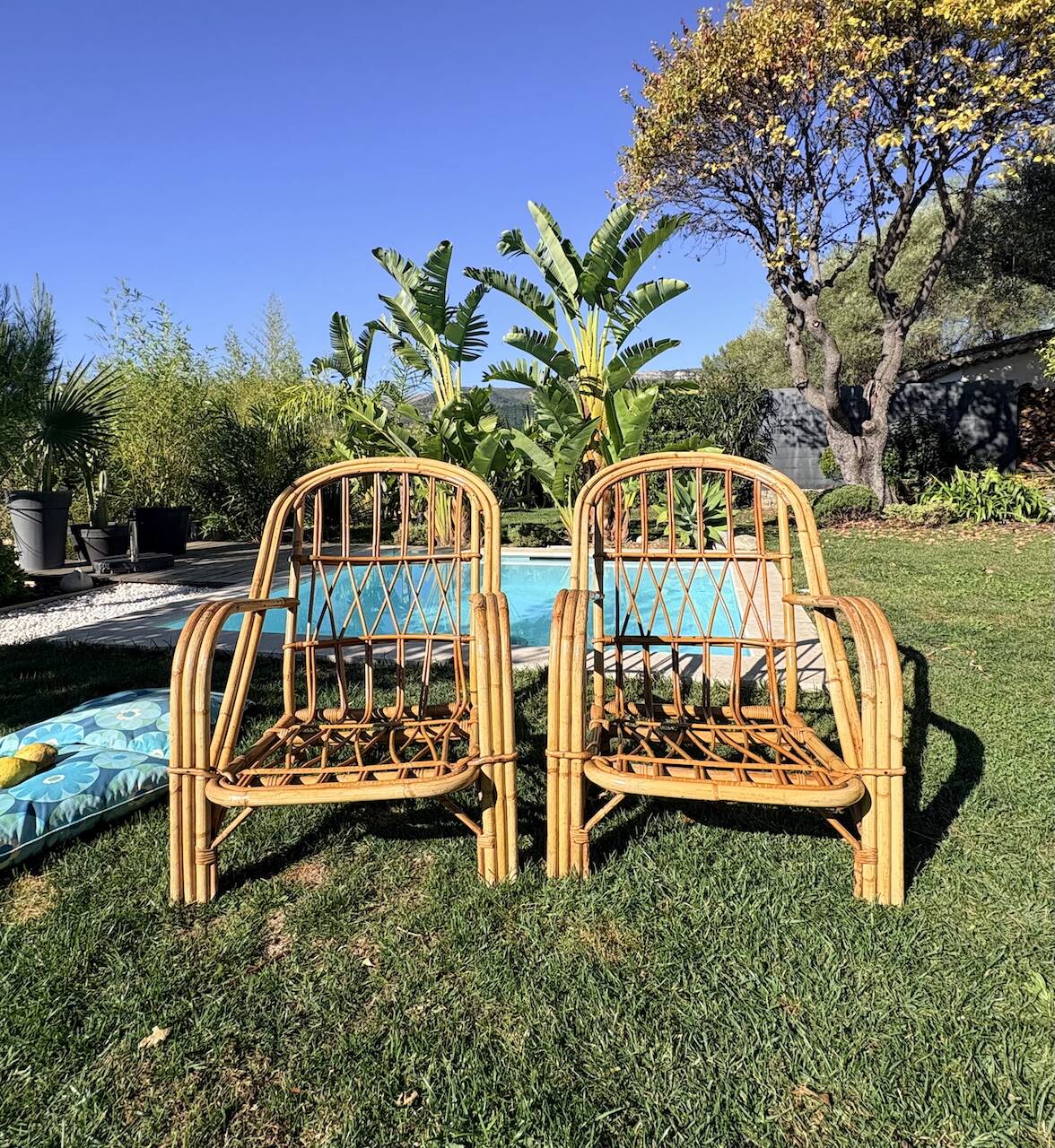 Pair of rattan armchairs "Audoux-Minnet" 1960