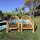 Paire de fauteuils en rotin "Audoux-Minnet" 1960